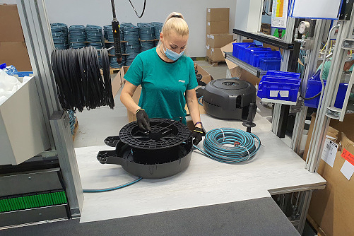 Employee assembling a hose rewinder