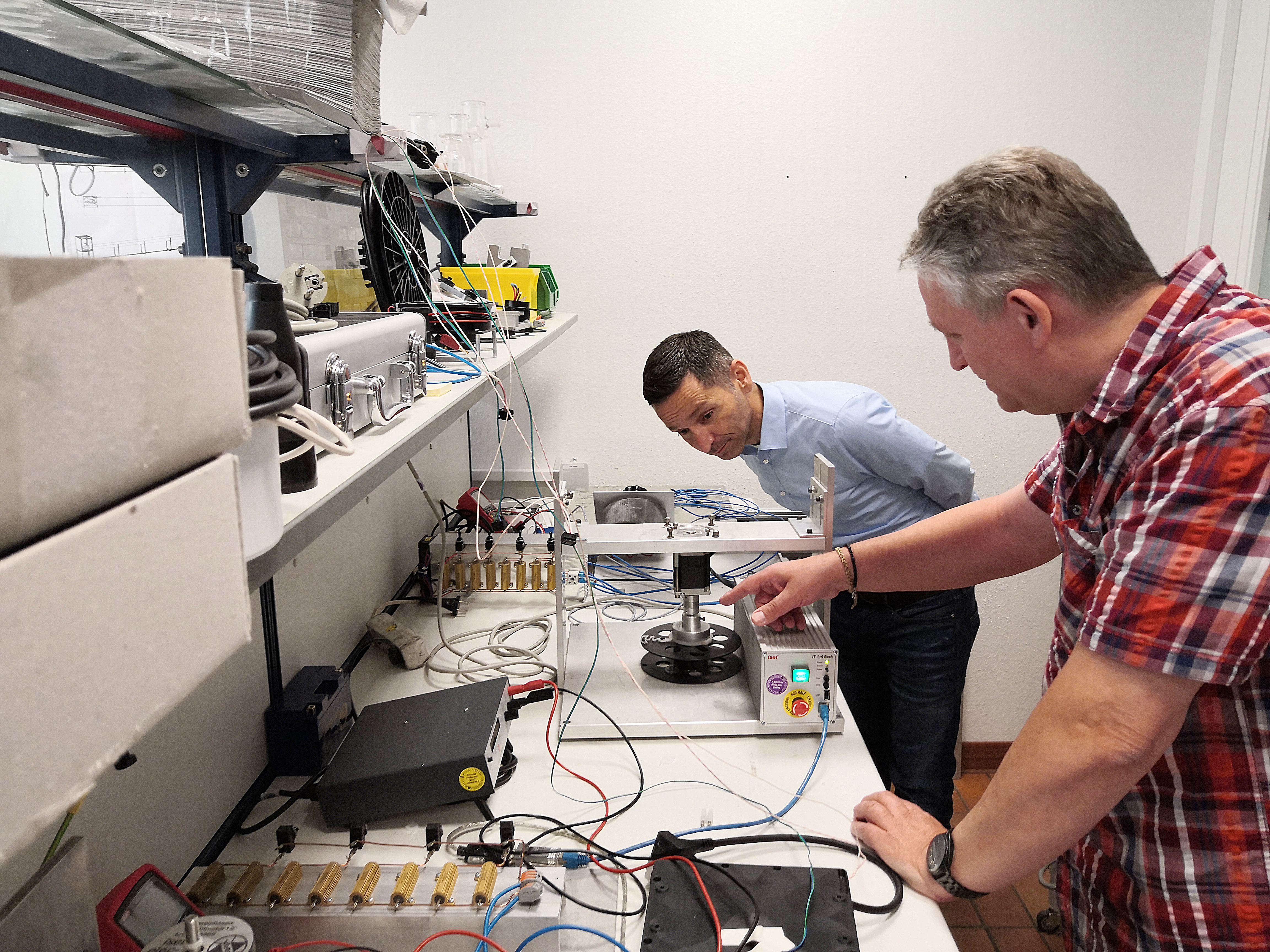 Two people looking at rewinding system