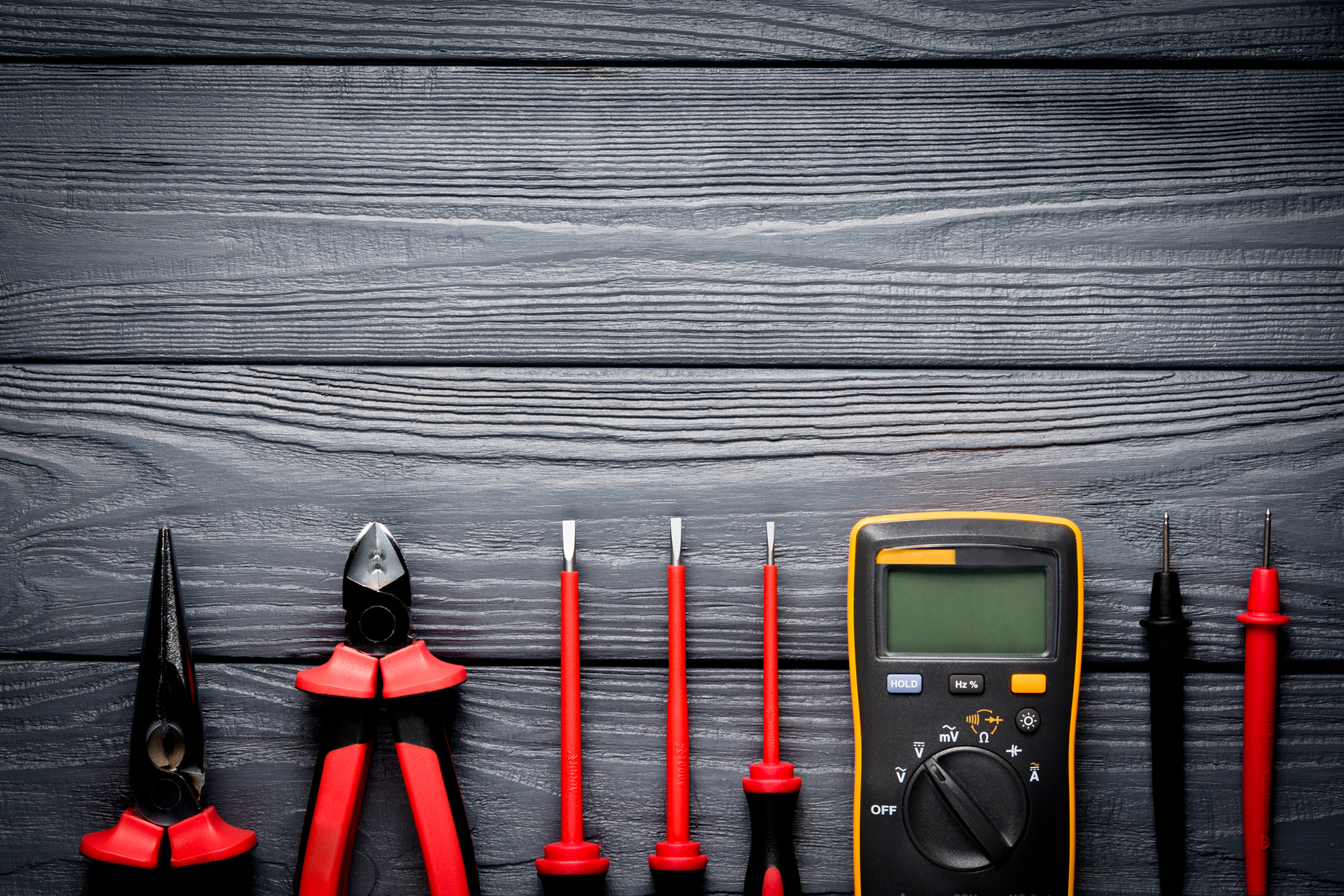 Red tool on black background