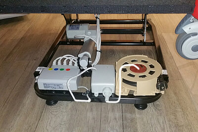 Sketch of the integration of the cable rewinder into the stand-up chair